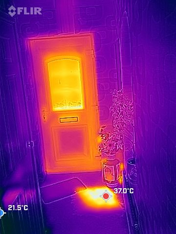Thermal image of hot spot through a door's window.